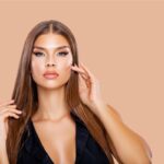 Why Feminine Rejuvenation Is Becoming More Popular 1 Young Woman holding her long natural brown Hair